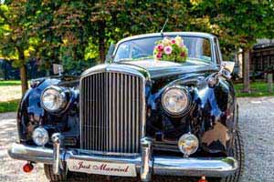 A black vintage wedding car